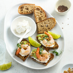 Roasted shrimps with cream cheese on toast