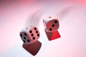 White Dice in Motion on a White Shadowy Background