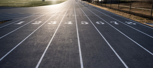 Numbered Lanes of a Track and Field Starting Point - obrazy, fototapety, plakaty