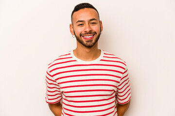 Fototapeta premium Young hispanic man isolated on white background happy, smiling and cheerful.