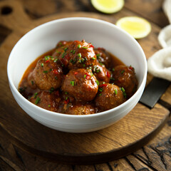 Homemade meatballs with tomato sauce and chili