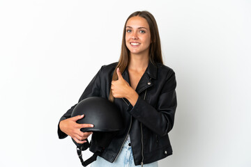 Woman with a motorcycle helmet over isolated white background giving a thumbs up gesture