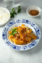 Roasted potato with red pesto and cheese