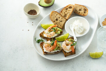 Roasted shrimps with cream cheese on toast