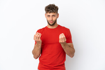 Young caucasian handsome man isolated on white background making money gesture but is ruined