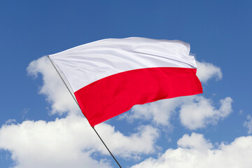 3d illustration. A beautiful view of Poland flag on a blue sky background.