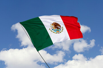 3d illustration. A beautiful view of Mexico flag on a blue sky background.