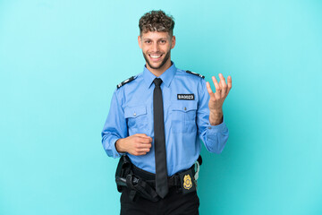 Young police blonde man isolated white on blue background making guitar gesture
