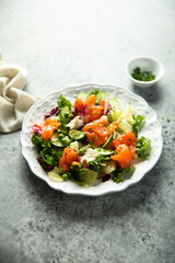 Healthy vegetable salad with smoked salmon