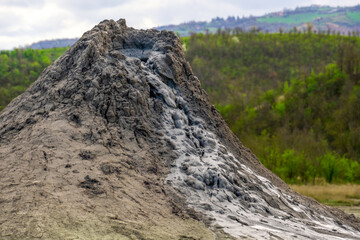mud volcano or mud dome in Italy, geological phenomenon by eruption of mud, water and methane gas