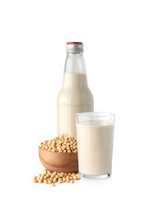 Soybeans or soya bean in a wooden bowl and Soy milk isolated on white background.