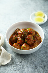 Homemade meatballs with tomato sauce and chili