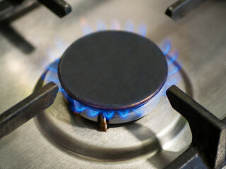 Close-up of a gas burner with burning gas. Natural gas