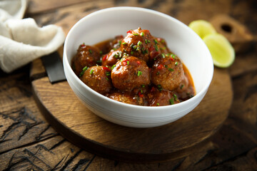 Homemade meatballs with tomato sauce and chili