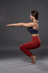 Yoga woman in Utkatasana pose