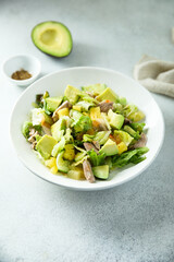 Healthy salad with duck, pineapple and avocado