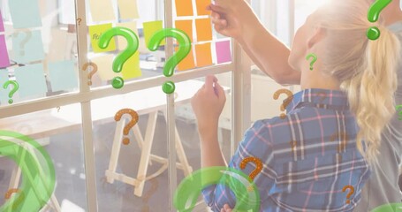 Animation of green and red question marks over business people looking at memo notes - Powered by Adobe