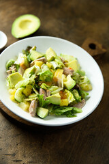 Healthy salad with duck, pineapple and avocado