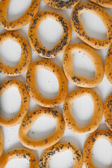 Dried bagels with poppy seeds on a white background