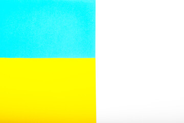 Paper yellow and blue colours as the symble flags of Ukraine. Background for protest against war, military conflict.
