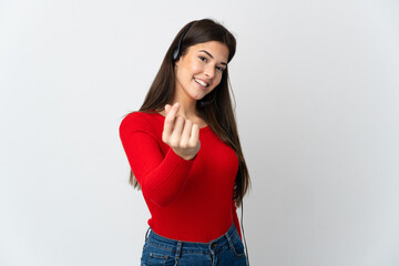 Young Brazilian telemarketer girl over isolated background making money gesture