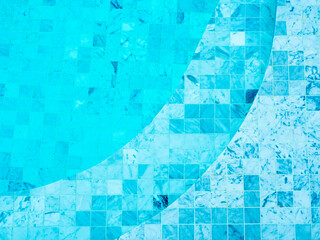 Mosaic grid pattern background with curved steps in blue water surface in the swimming pool...