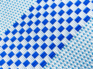 Abstract white and blue rattan pattern background. Close-up checkered pattern caused by the interweaving of white and blue lines, top view.