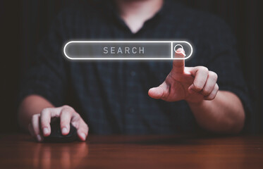 Hand touching to virtual search icon to SEO or search Engine Optimisation for marketing and...