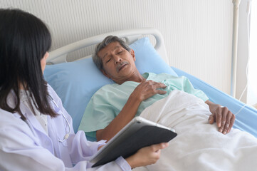 Fototapeta premium Asian senior male patient is consulting and visiting doctor in hospital....
