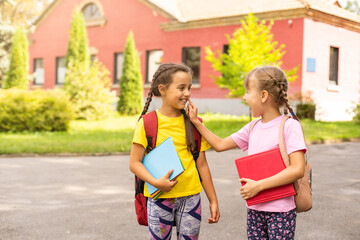 Naklejka premium Happy life. Happy smiling friends. Have fun. Happy kids relaxing outdoors. Joyful friends. Sisterhood and friendship. Cheerful schoolgirls on sunny day.
