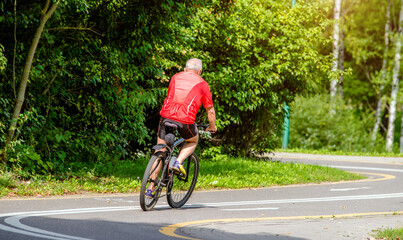 Cyclist ride on the bike path in the city Park
