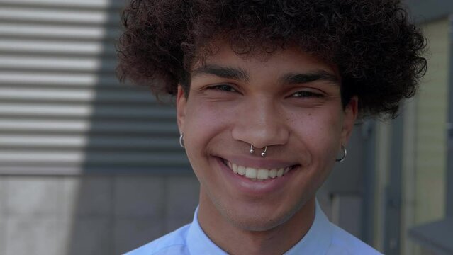 Portrait sincerity face african american guy in shirt looking at camera enjoying handsome confident lifestyle in outdoors