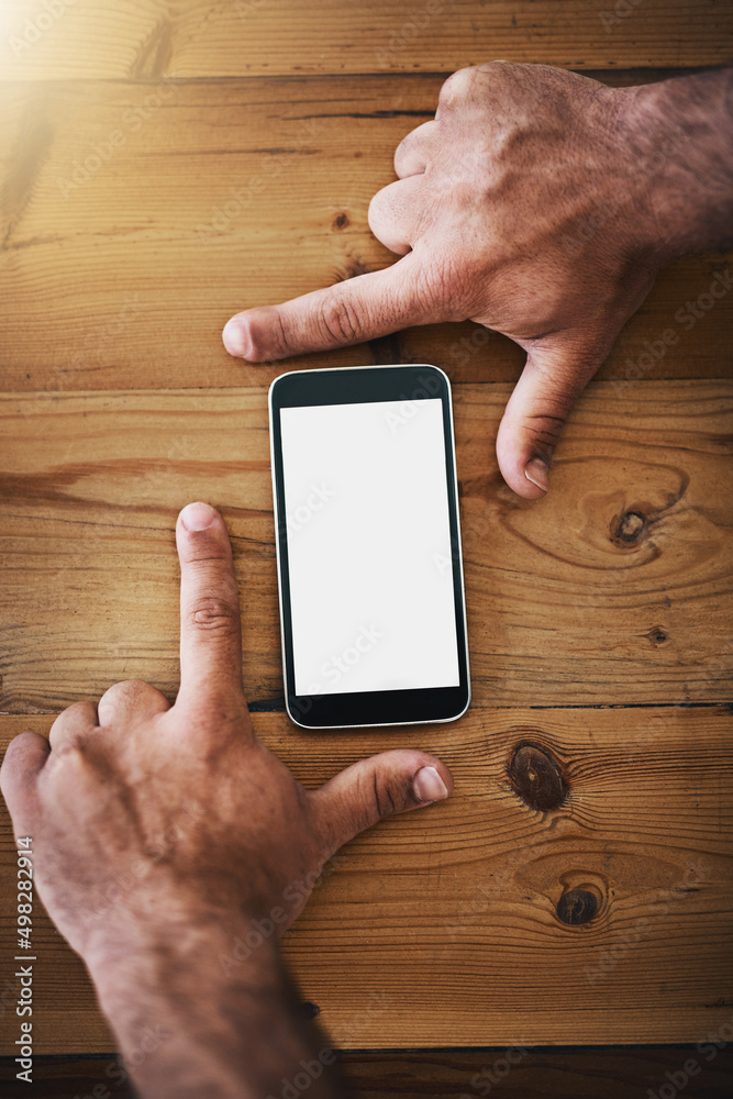 Poster Big ideas for a tiny device. Cropped shot of an unrecognizable businessman framing a mobile phone on a desk.