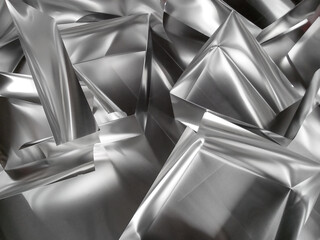 square shaped pieces of shiny silver aluminum metal flakes. metal background, silver metal...