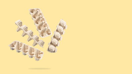 An egg carton for recycling flies and floats in the air. An egg packaging made of recycled...