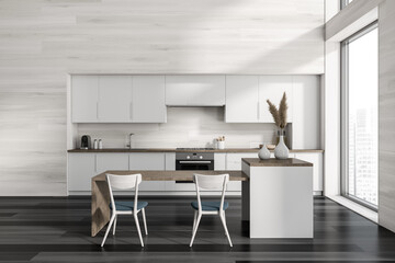 Front view on dark kitchen room interior with island, chairs