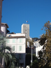 View of houses of the old town and the tower of the castle of Cannes, France