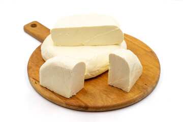 Fresh feta cheese on a white background. Delicious assortment of cheeses. close up