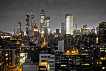 Epic skyline of New York City black and white night view with yellow lights - 498287751