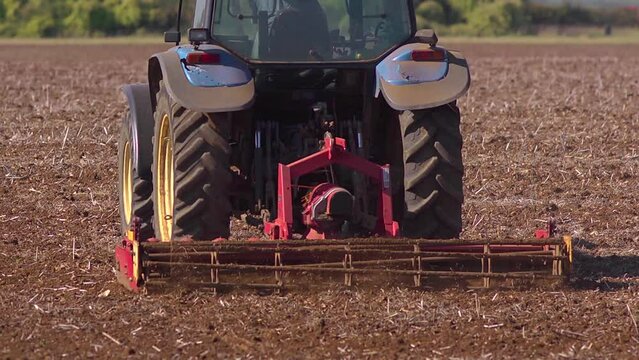 Close up of a powered harrow in action. Slow motion 2