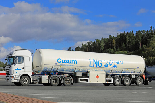 White Scania Tanker for Gasum LNG Transport on Truck Stop Yard in Finland. 
