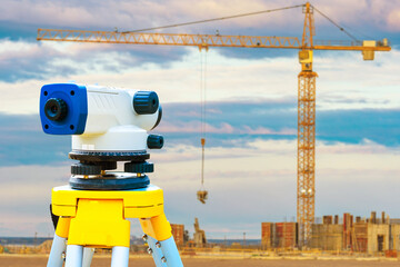 Surveyor equipment on construction site background. Geodetic equipment of a total station or...
