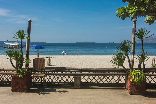 A beautiful beach scene flanked with Dracaena plants. At a resort in Barretto Beach, a popular tourist spot near Subic in Olongapo, Zambales.