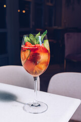 Glass of cocktail standing on a table, summer days.