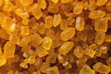 Extreme macro crystals of cane sugar. Abstract sugar background close-up in shallow depth of focus