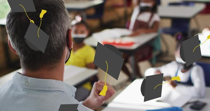 Animation of graduation cap icons over diverse schoolchildren and teacher wearing face masks