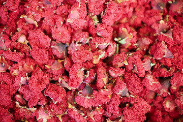 Dried flowers of pomegranate, herbal tea texture background. Dry pomegranate flower buds at market