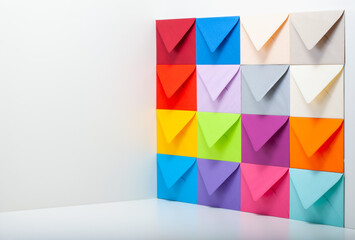 Different colored envelopes on the wall