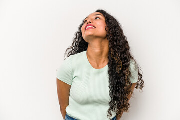 Young hispanic woman isolated on white background relaxed and happy laughing, neck stretched showing teeth.