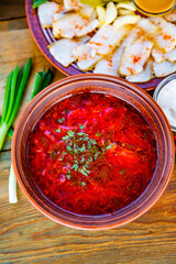 Borscht is a traditional Ukrainian food made from meat, beets, potatoes, carrots and greens. 